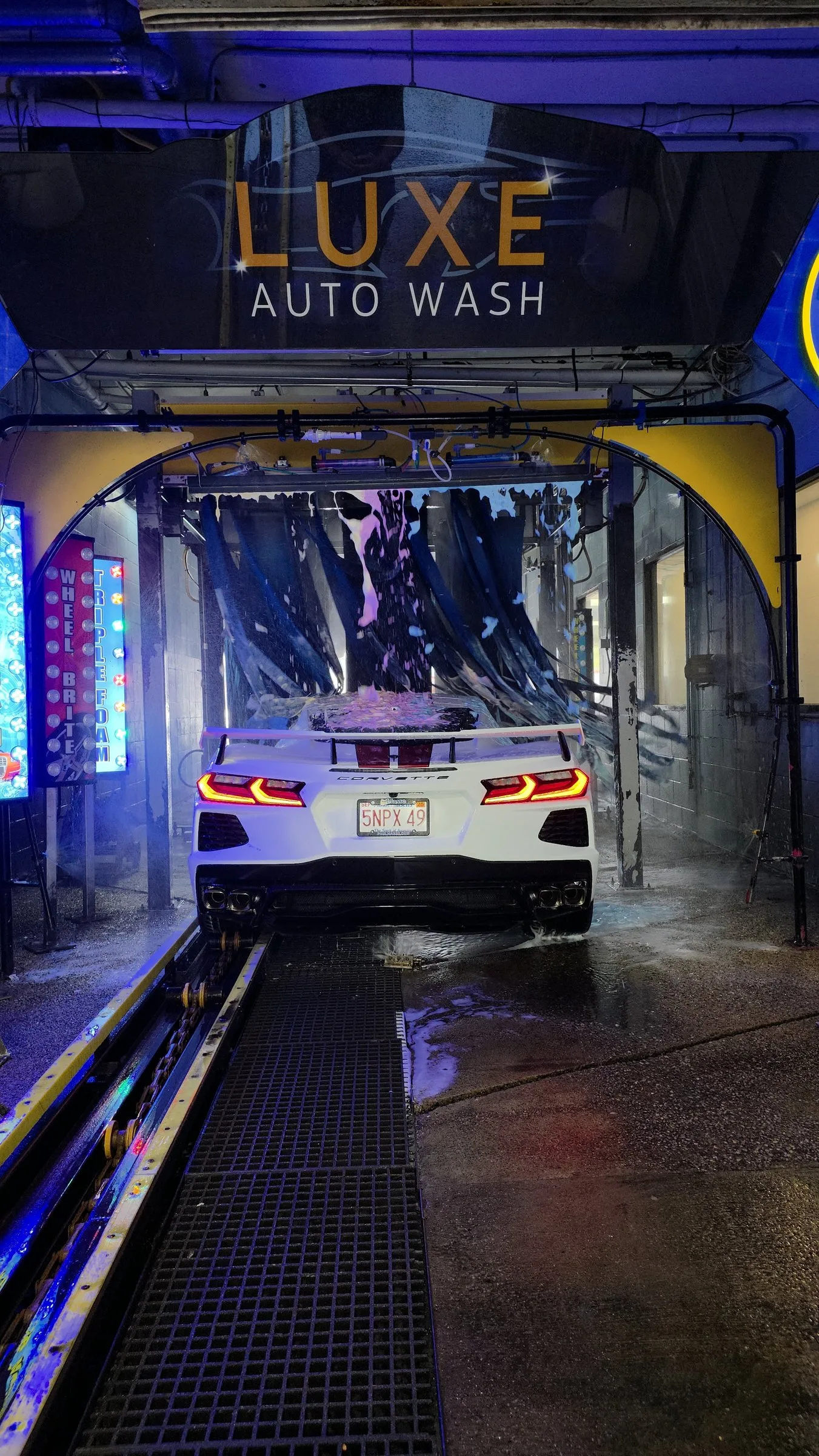 A Corvette entering the Luxe Auto Wash tunnel